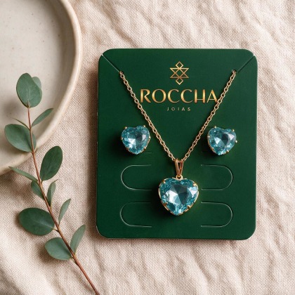 CONJUNTO DE COLAR E BRINCO FORMATO CORAÇÃO ZIRCONIA AZUL CLARO BANHADO A OURO